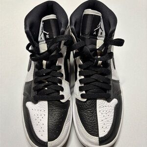 Women’s Jordan Black and White High-Top Sneakers